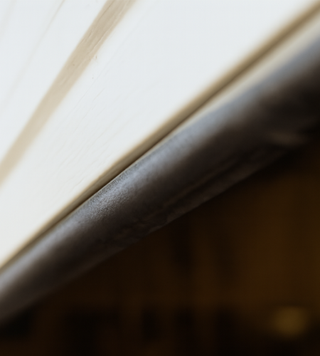 Close-up of garage door bottom weather seal providing protection against dust, water, and pests