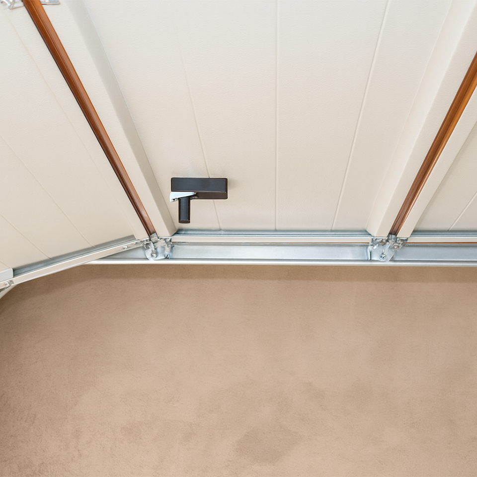 Close-up view of a garage door track system with rollers and metal frame installation